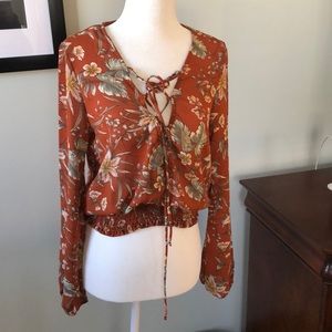 Mixed floral lace up bell sleeve top